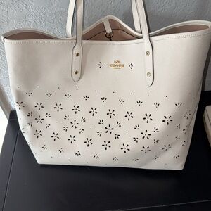 Light cream color Coach City tote and matching wallet. Pic on white background
